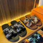 A collection of stylish and comfortable slides for men on a wooden shelf