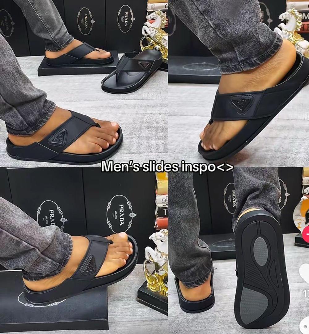 A pair of Prada slides worn by a man, showcasing the comfort and style of the luxury footwear
