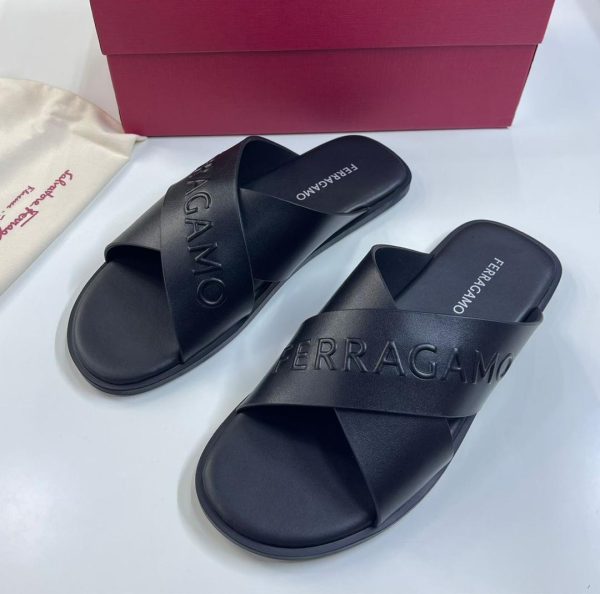 Stylish black slide sandals with Ferragamo branding for a trendy summer look. Best online store for clothes and shoes.