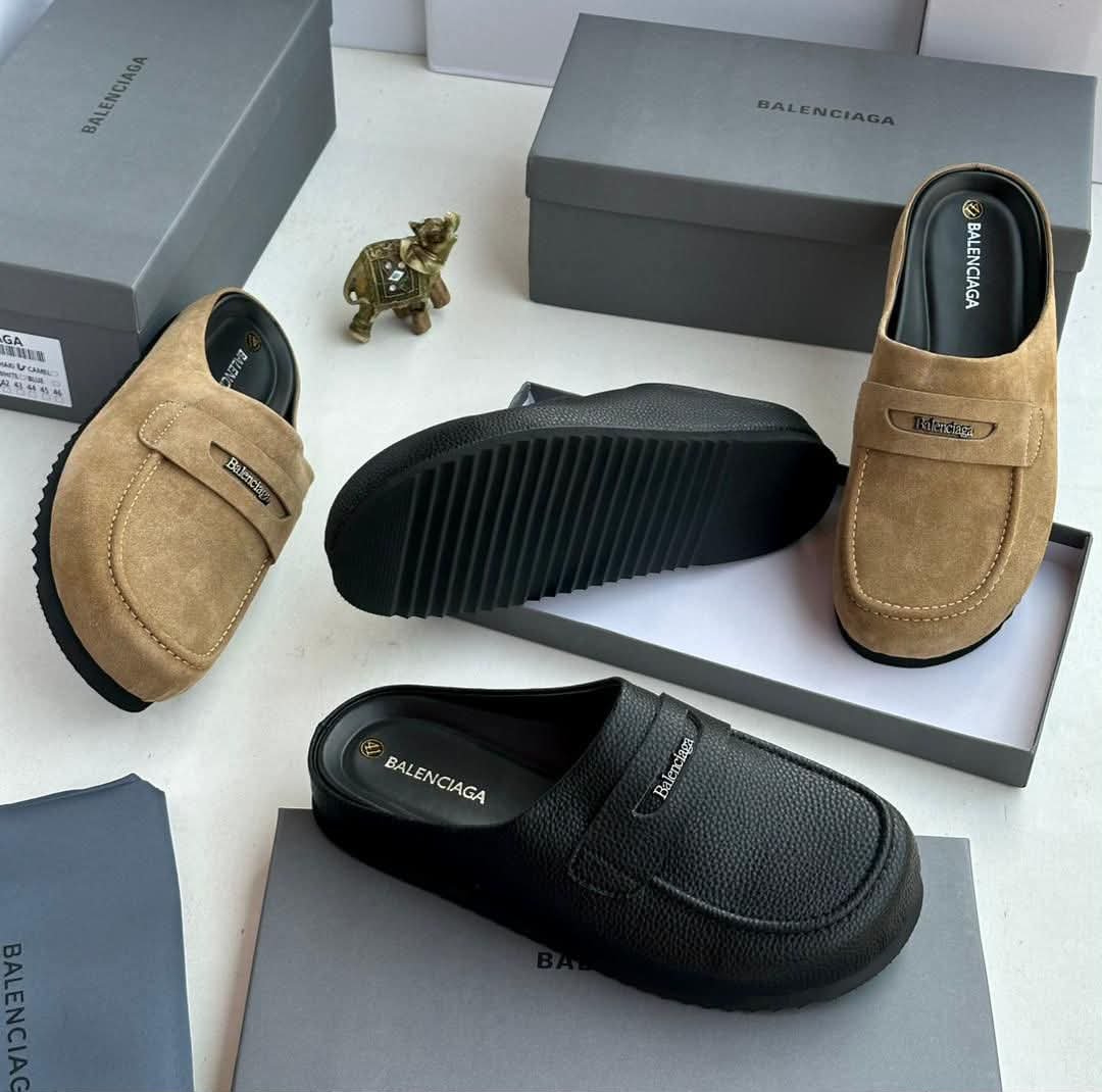 A pair of black and tan Balenciaga loafers with boxes, perfect for stylish men in Nigeria looking for comfortable footwear.
