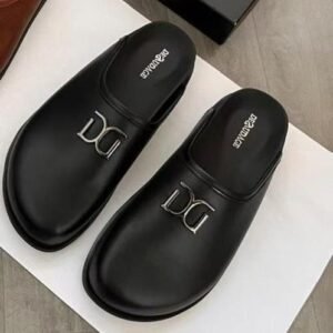 A pair of black leather DG logo slip-on sandals on a white background, perfect for stylish and comfortable footwear.