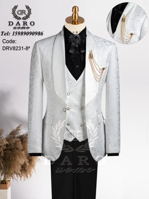 A mannequin wearing a luxurious white and black tuxedo suit with gold accents, perfect for formal events.