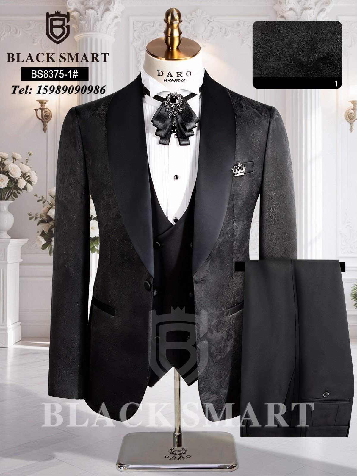 A mannequin wearing a black tuxedo suit with waistcoat and pocket square, perfect for formal events.