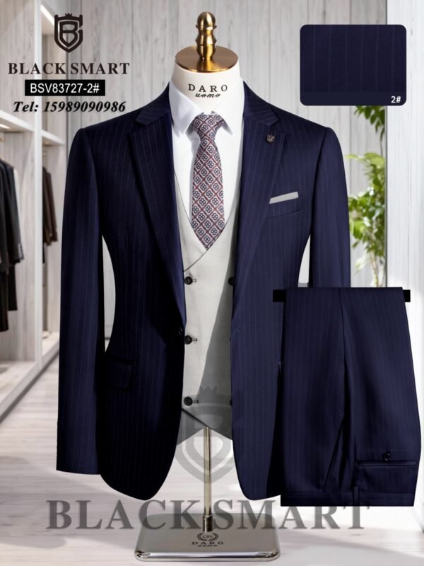 A navy blue pinstripe suit with a white vest and patterned tie on a mannequin, showcasing a stylish and formal outfit.
