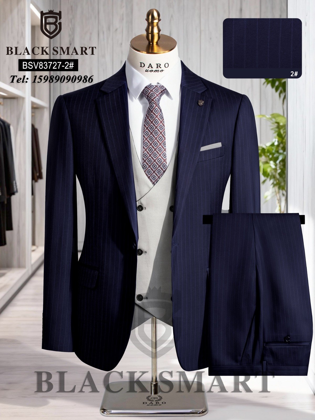 A navy blue pinstripe suit with a white vest and patterned tie on a mannequin, showcasing a stylish and formal outfit.