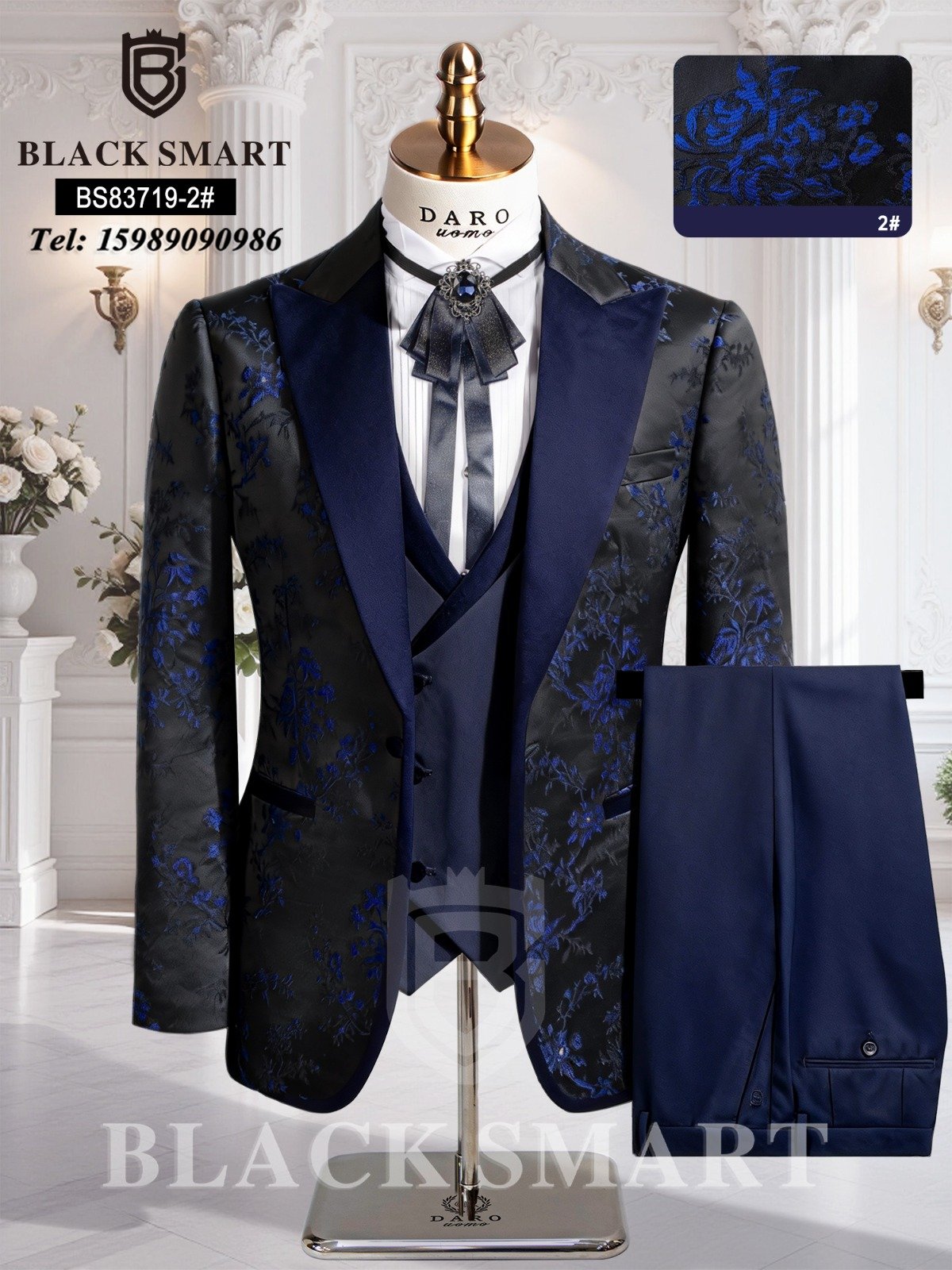 A navy blue suit with floral pattern, including jacket, vest, and trousers, displayed on a mannequin.