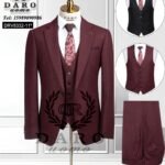 A mannequin wearing a maroon three-piece suit with a matching tie and vest options, showcasing the stylish and sophisticated design of the suit.