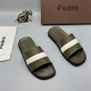 A pair of stylish brown slides with navy blue and white stripes, accompanied by a brown shoe box and accessories, all bearing the 'Pedro' brand name.